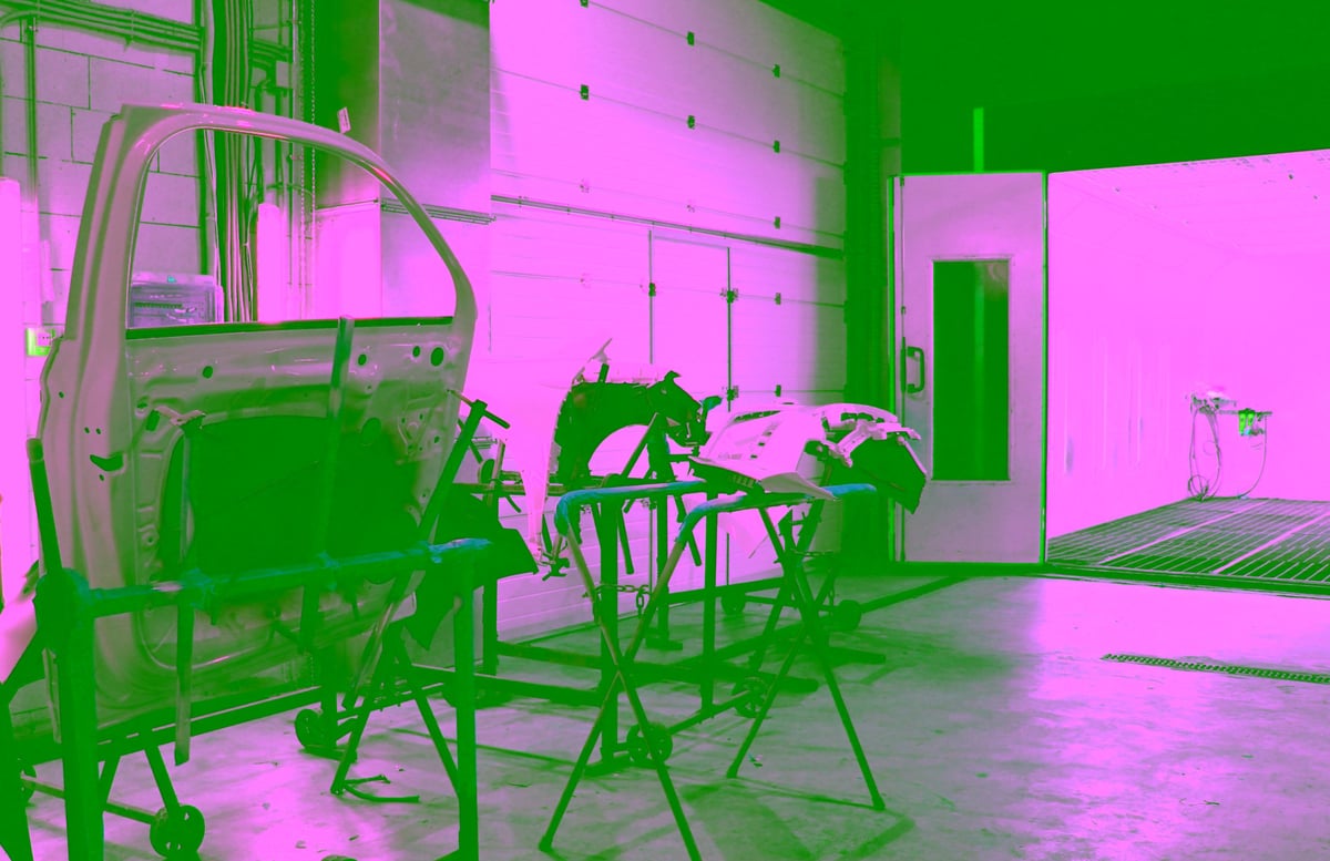 Metal parts coated with protective layer of paint in industrial facility